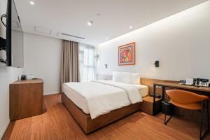 Hotel Cielo客房内的一张或多张床位