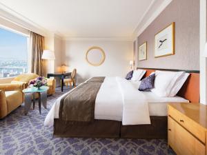 Postel nebo postele na pokoji v ubytování Hotel Hankyu International