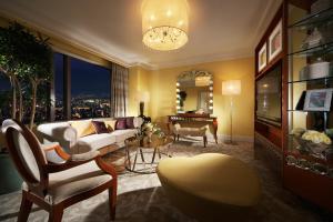 a living room with a couch and a table at Hotel Hankyu International in Osaka