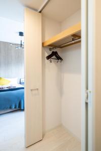 A bed or beds in a room at Lite House Dotonbori