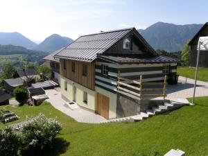a house with a metal roof on a hill at Apartment Altaussee in Altaussee