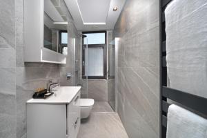 a bathroom with a white toilet and a sink at Union Hotel Plat Inn -Special Category in Istanbul +24 photos