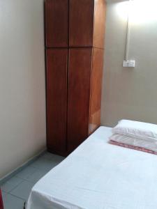 Postel nebo postele na pokoji v ubytování HotelMalaya