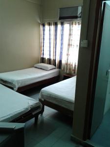 Postel nebo postele na pokoji v ubytování HotelMalaya