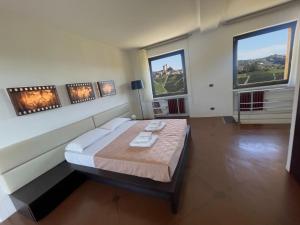 Postel nebo postele na pokoji v ubytování Cascina Parafada