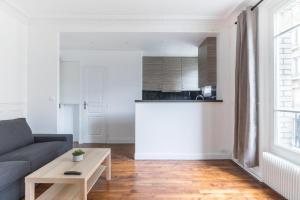 Una cocina o zona de cocina en Magnifique appartement Neuilly:Cosy Appartement1BR