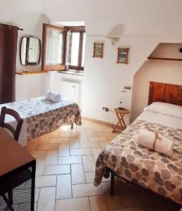 Postel nebo postele na pokoji v ubytování La grotta di NiMa