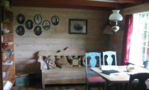 a living room with a couch and a table at Haugland Gard in Haugaland +15 photos