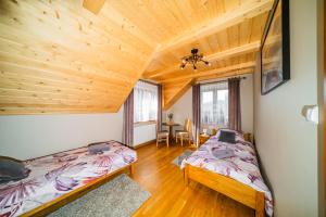 Posteľ alebo postele v izbe v ubytovaní Willa na Wzgórzu + 28 fotografií
