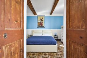 מיטה או מיטות בחדר ב-IL RIFUGIO SUL MARE - GenovaInRelax