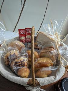 a basket of breads and pastries on a table at L’atelier de Graslin in Nantes