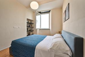 A bed or beds in a room at Baiàn Casa Vacanze