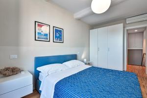 Posteľ alebo postele v izbe v ubytovaní Baiàn Casa Vacanze