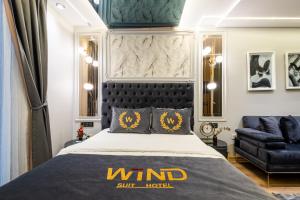 A bed or beds in a room at Wind Suit