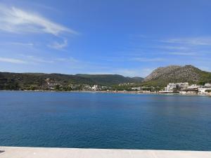 a large body of water with mountains in the background at Finikas Rooms in Agia Marina Aegina