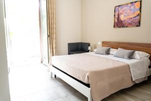 Postel nebo postele na pokoji v ubytování Gennaro Holidays Appartament