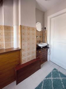 a bathroom with a sink and a mirror at Ferienhaus Schuhhof in Quedlinburg +32 photos