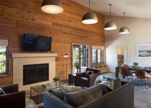 a living room with a couch and a fireplace at Alila Ventana Big Sur Adult Only in Big Sur