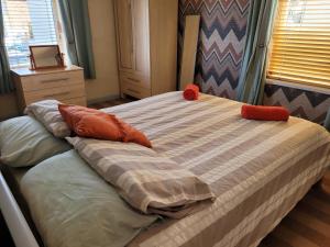 a bed with two pillows on it in a bedroom at No 27 Guisborough - 1 bed apartment in Guisborough