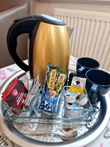 a coffee pot sitting on a table with a tray at H5 Hotel Bremen in Bremen