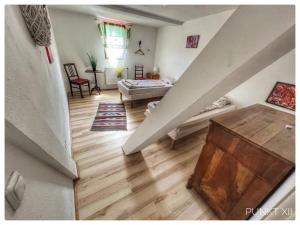 a room with a staircase and a living room at Wohnung 4 in Burghaslach