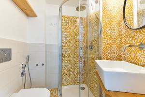 a bathroom with a shower and a sink and a toilet at Villa Fantagali apt 501 in Marina di Campo