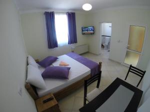 Postel nebo postele na pokoji v ubytování Hotel Bicaj