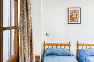 Posteľ alebo postele v izbe v ubytovaní Villa La Flor con piscina