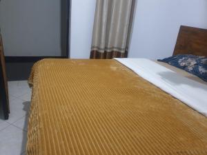 Postel nebo postele na pokoji v ubytování Rosa Negra Uganda