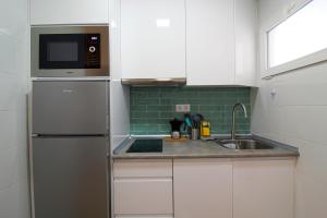 Η κουζίνα ή μικρή κουζίνα στο Apartamento Vista Picos +9 φωτογραφίες