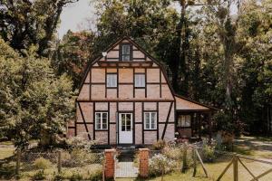 Zahrada ubytování Casa de campo em Joinville com Hidromassagem e Lareira