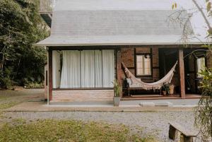 Zahrada ubytování Casa de campo em Joinville com Hidromassagem e Lareira