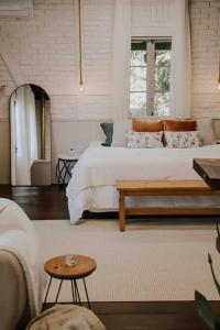 Postel nebo postele na pokoji v ubytování Casa de campo em Joinville com Hidromassagem e Lareira