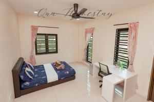 Ένα ή περισσότερα κρεβάτια σε δωμάτιο στο Qua Homestay 5 Rooms 6 Bathrooms