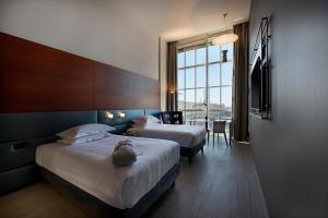 Postel nebo postele na pokoji v ubytování DoubleTree by Hilton Turin Lingotto + 35 fotografií