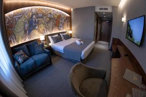 Postel nebo postele na pokoji v ubytování Orienta Hotel Gyumri
