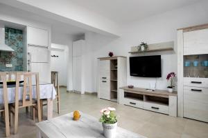 Μια τηλεόραση ή/και κέντρο ψυχαγωγίας στο Apartamento Atalaya