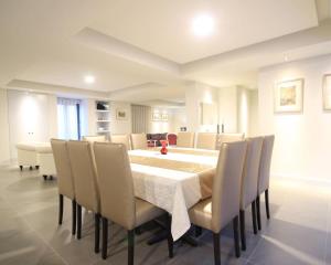 a dining room with a table and chairs at Villa Camacho iv - Mansion House in Arco da Calheta