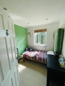 a small bedroom with a bed and a window at Home from home Norwich centre in Norwich