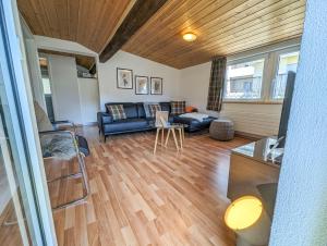 Posezení v ubytování Chalet Schwarzsee by Arosa Holiday