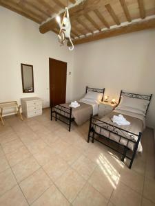 A bed or beds in a room at B&B I Giardini