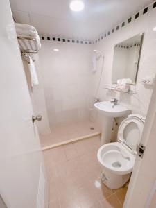 Koupelna v ubytování 新獅城商務旅館New Lion City Hotel