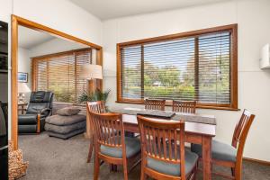 a living room with a dining room table and chairs at Machiya Rhyll Phillip Island in Rhyll