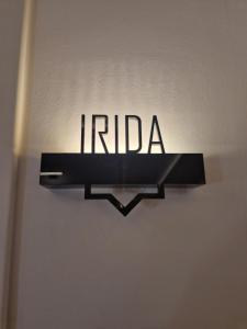 a sign that reads india hanging on a wall at Jensen Luxury Suites in Rhodes Town