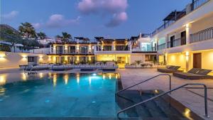 a swimming pool in the middle of a building at Sierra Blanca Resort and Spa in Marbella