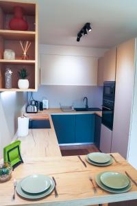 Η κουζίνα ή μικρή κουζίνα στο Premium new apartment with panoramic castle view