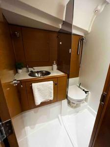 a small bathroom with a sink and a toilet at Dubrovnik Luxury Sailing in Dubrovnik