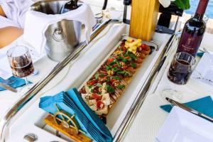 a table with a tray of food on a boat at Dubrovnik Luxury Sailing in Dubrovnik