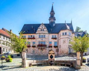 an old building with a tower on top of it at FourElements Grand Chalet in Blankenburg