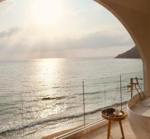 a bathroom with a view of the ocean at Elite Atoll Khanom - Luxury Coastal Escape in Khanom